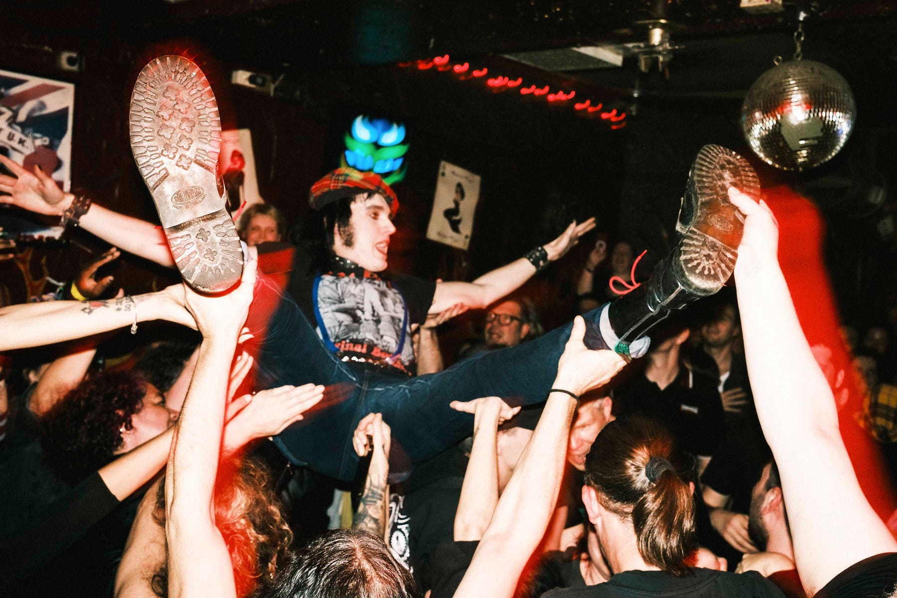 Crowd surfing at a Los Fastidios concert in Berlin